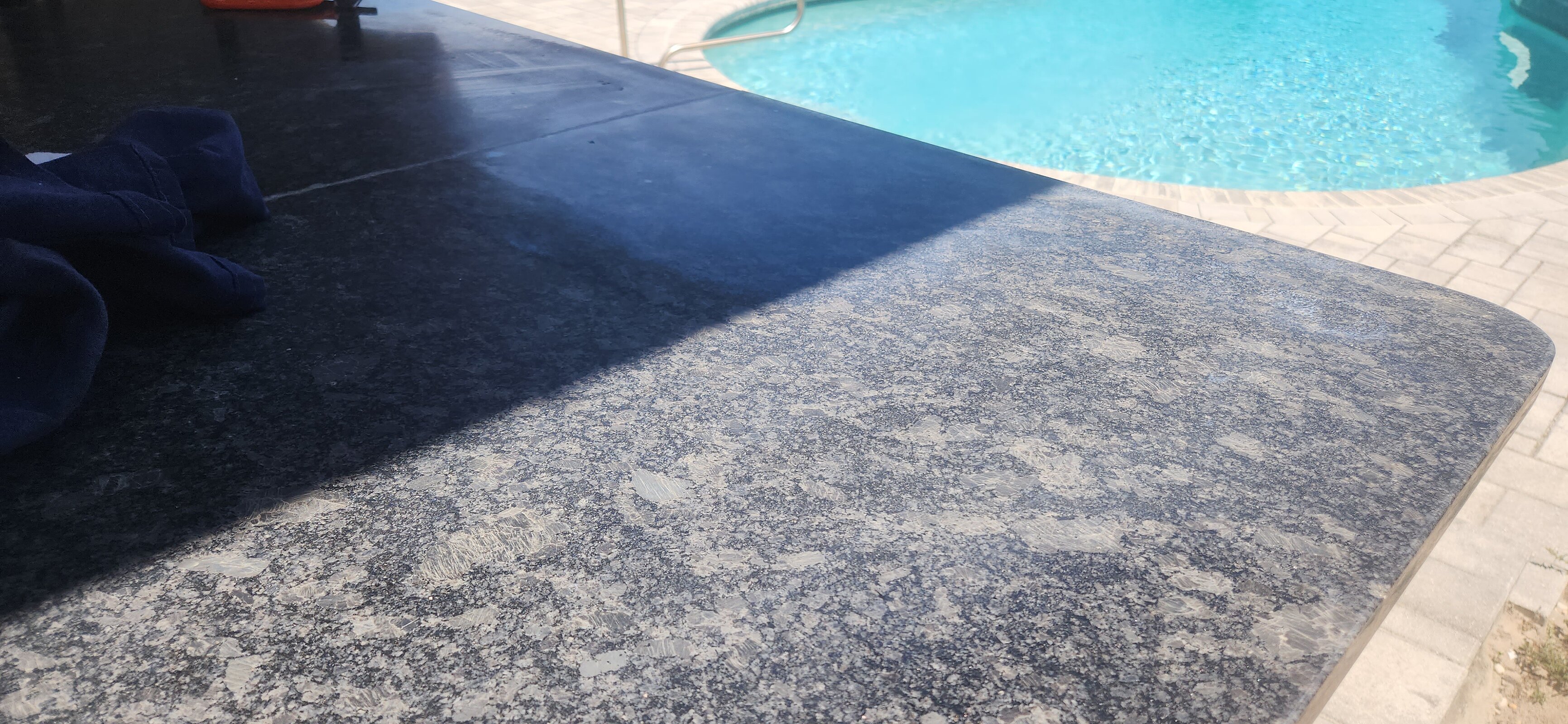 Patio stone counter requiring restoration and edge polish