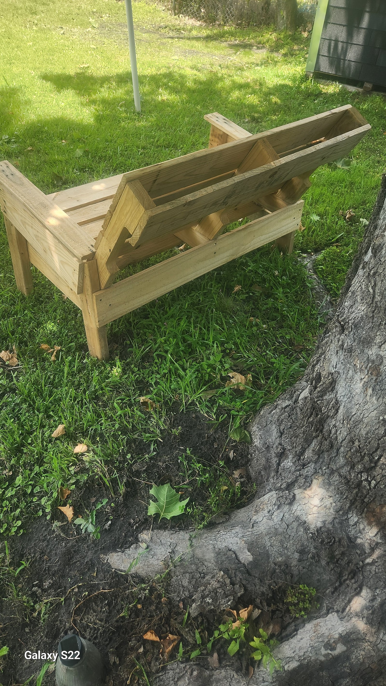 Pair of custom wooden patio love seat benches ready for outdoor use