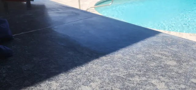 Close up of dull, unsealed granite surface on patio kitchen